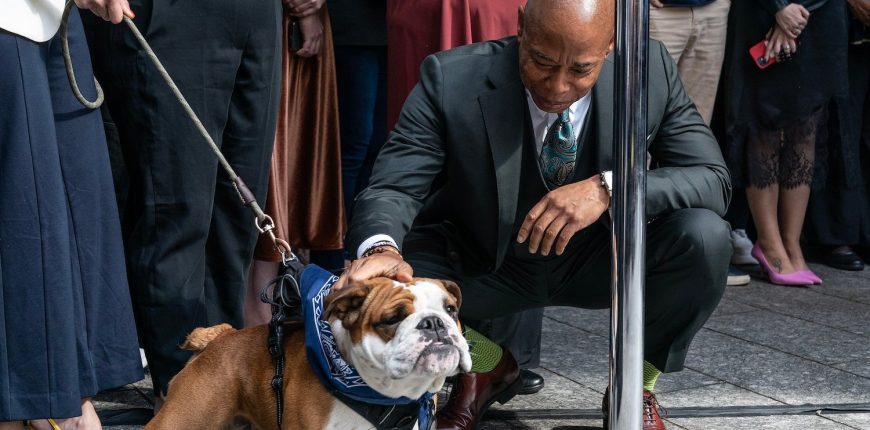 Eric-Adams-hanging-out-with-a-bulldog.jpg