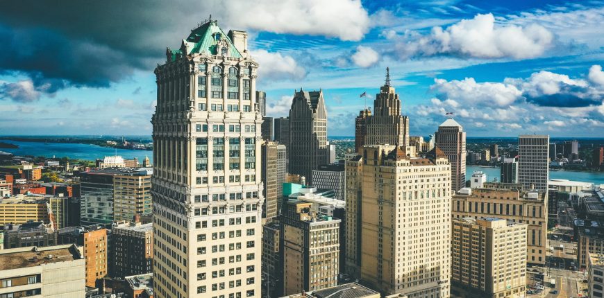 cityscape-detroit-sunlight-dark-cloudy-sky-daytime-scaled.jpg