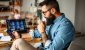 man-examines-cryptocurrency-investments-home-laptop_iStock-1347340865.jpg