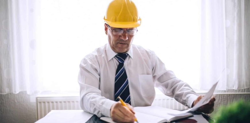 Man-in-hard-hat-writing-in-diary-16_9-1200x675.jpg