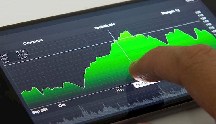 mobile-phone-with-stock-chart-62799468_Large.jpg