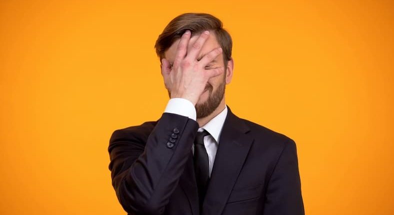 Man-in-suit-face-palms-16_9.jpg