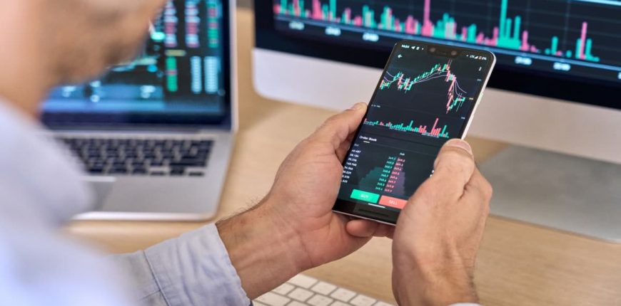 trader_investor_broker_using_smartphone_width_1200_format_jpeg_6789d40231.jpg