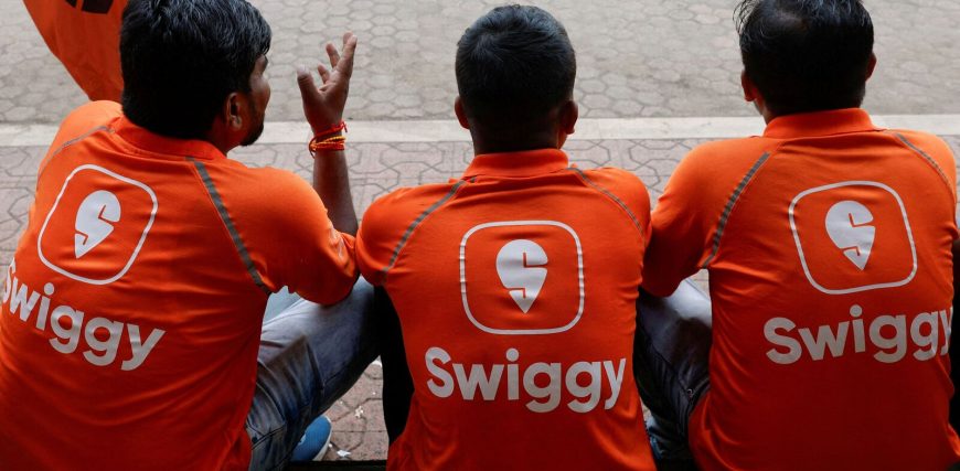 FILE-PHOTO-Swiggy-gig-workers-talk-to-each-other-_1739441594178_1746697013989.jpg