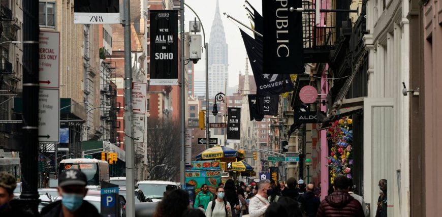 People-wearing-facemasks-walk-in-the-Soho-section-of-New-York-City-March-25-2021-The-state-allowed.jpeg