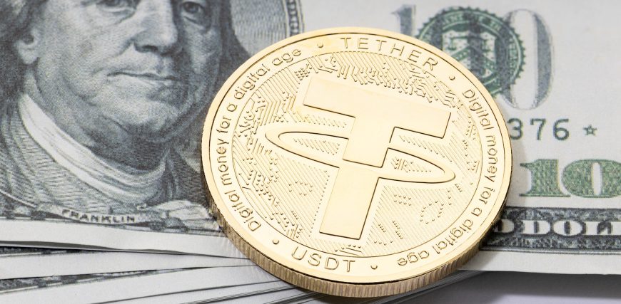 tether-usdt-coin-on-stacked-dollar-banknotes.jpg