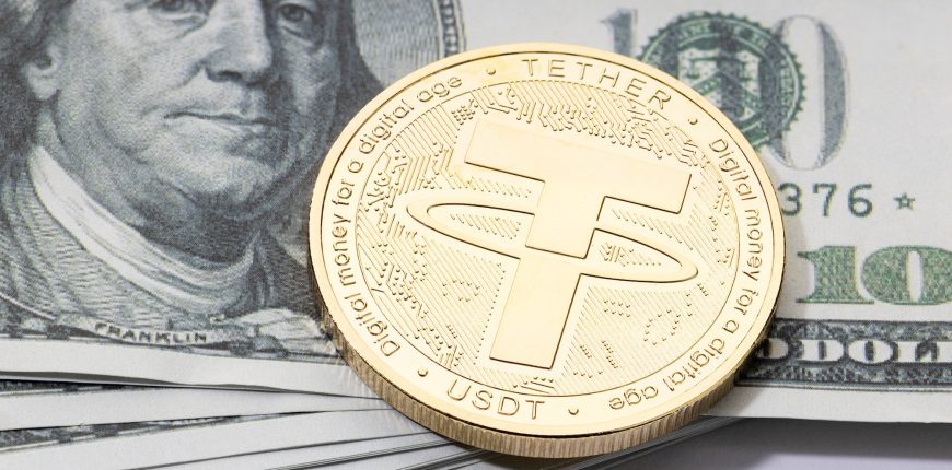 tether-usdt-coin-on-stacked-dollar-banknotes.jpg
