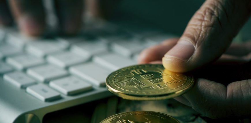 bitcoins-and-man-using-computer-iStock-1200x630.jpg
