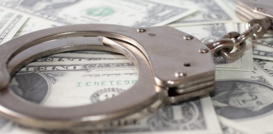 closeup-view-metal-handcuffs-dollars-1024x683.jpg