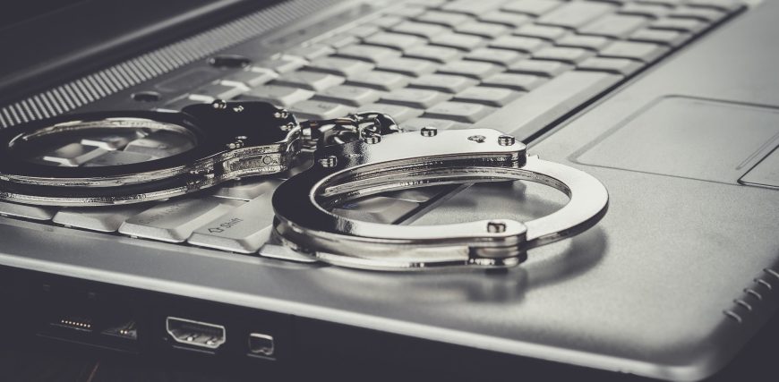 handcuffs-on-laptop-cyber-crime-concept.jpg
