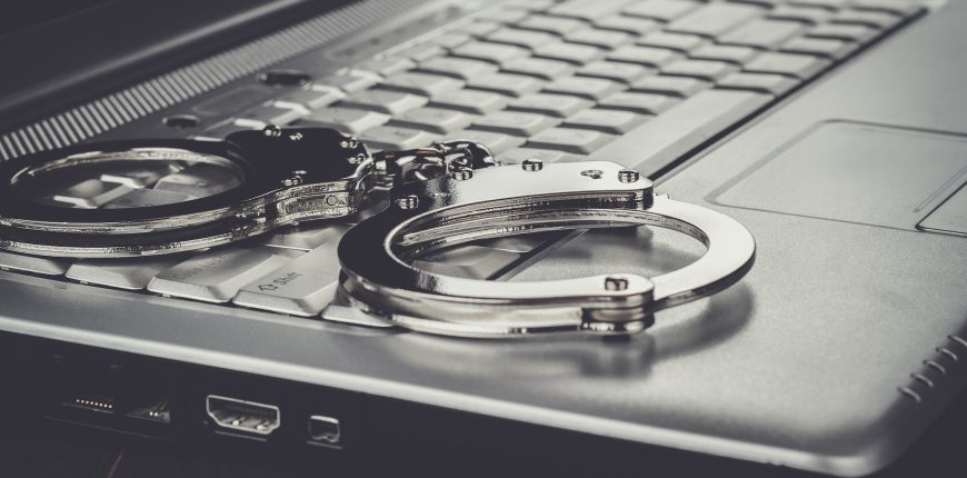 handcuffs-on-laptop-cyber-crime-concept.jpg