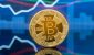 BTC-coin-over-blue-financial-chart.jpg