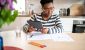 investors-considers-papers-on-a-table-while-holding-a-tablet.jpg