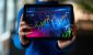 A-person-in-an-office-analyzing-and-reviewing-financial-graphs-for-market-insights.jpg