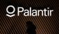 image-of-a-person-walking-in-front-of-a-palantir-logo.jpg