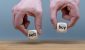 Hands-are-holding-two-cubes-with-the-words-sell-and-buy.jpg
