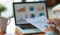 Wealth_laptop_and_doc_20250703_0904.jpg