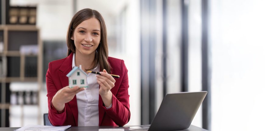 person-pointing-to-a-model-home.jpg
