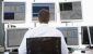 sitting_in_front_of_multiple_computer_screens_.width-600.jpg