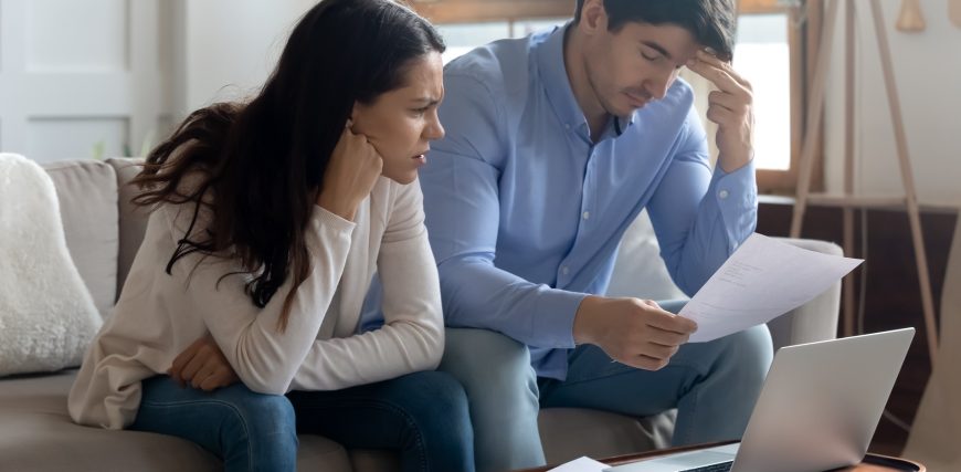 stressed-couple-bills-paperwork_iStock-1300340919.jpg