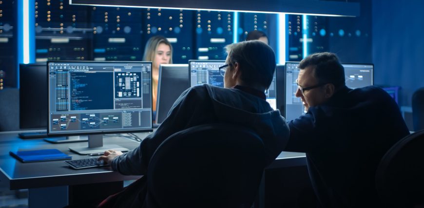 team-of-software-engineers-looking-at-a-computer-screen-with-artificial-intelligience-ai-on-it.jpg