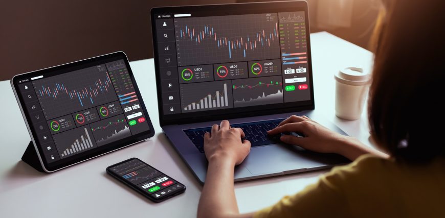 woman-trades-stocks-on-multiple-devices-laptop-phone-ipad_iStock-1185328919.jpg