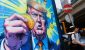 2208409748_people-walk-past-an-advertisement-feature-donald-trump-with-bitcoin-in-hong-kong-on-sunda.jpeg