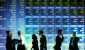 Stock-Exchange-Trading-wall-stock-market-people-on-phones-and-discussing-in-gront-of-wall-of-stock-f.jpeg