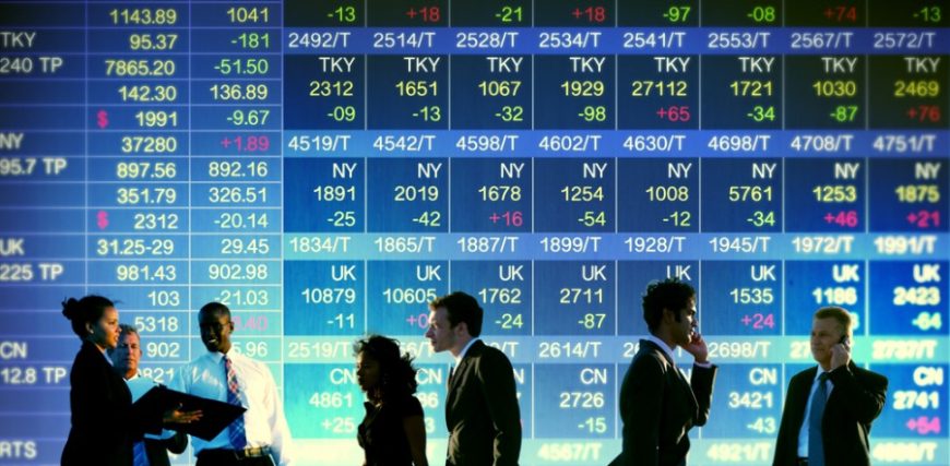 Stock-Exchange-Trading-wall-stock-market-people-on-phones-and-discussing-in-gront-of-wall-of-stock-f.jpeg