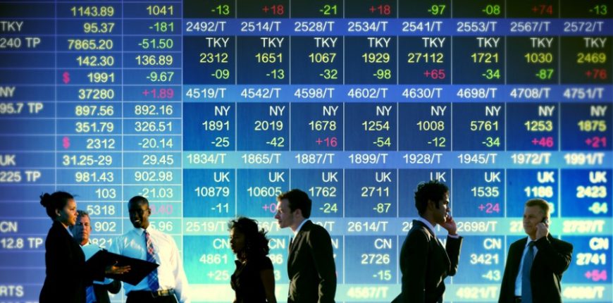 Stock-Exchange-Trading-wall-stock-market-people-on-phones-and-discussing-in-gront-of-wall-of-stock-f.jpeg