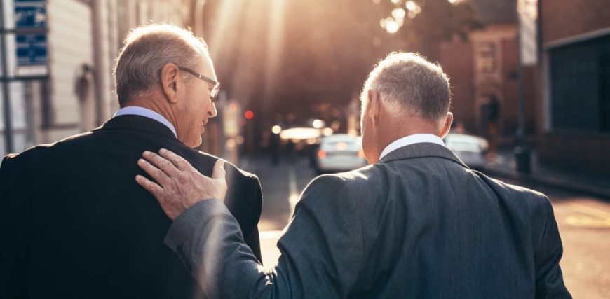 Two-men-in-suits-walking-down-street-16_9-1200x675.jpg