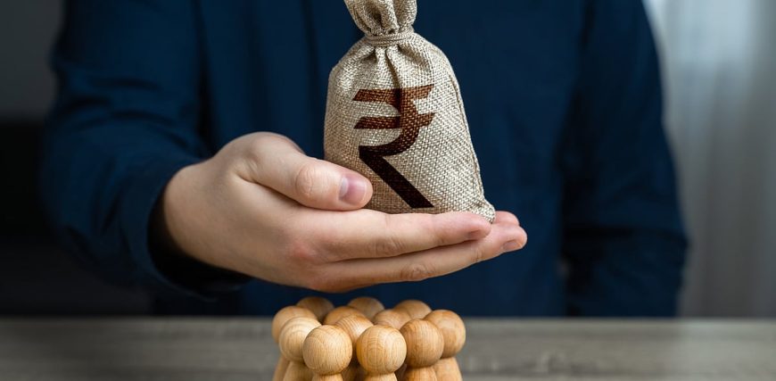 bloombergquint2F2024-062Fb8935107-4ace-479f-ab3b-541c58d609502Fa_man_is_holding_a_indian_rupee_mo.jpeg