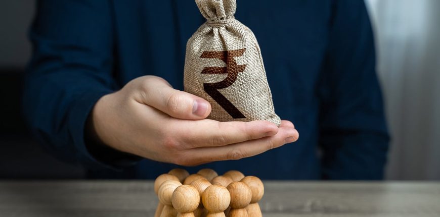 bloombergquint2F2024-062Fb8935107-4ace-479f-ab3b-541c58d609502Fa_man_is_holding_a_indian_rupee_mo.jpeg