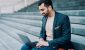 business-trader-laptop-smiling.jpg