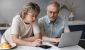 senior-mature-couple-discuss-finances-over-breakfast-at-laptop-calculator_iStock-1352716482.jpg