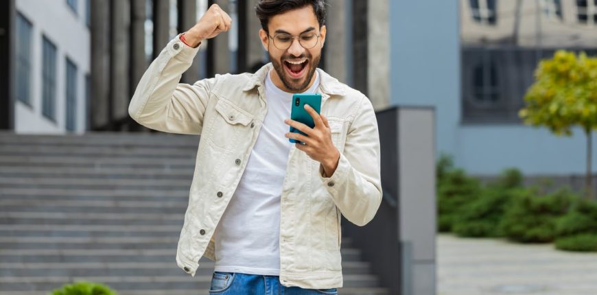 urlhttps3A2F2Fg.foolcdn.com2Feditorial2Fimages2F8439342Fyoung-smartphone-user-celebrating.j.jpeg