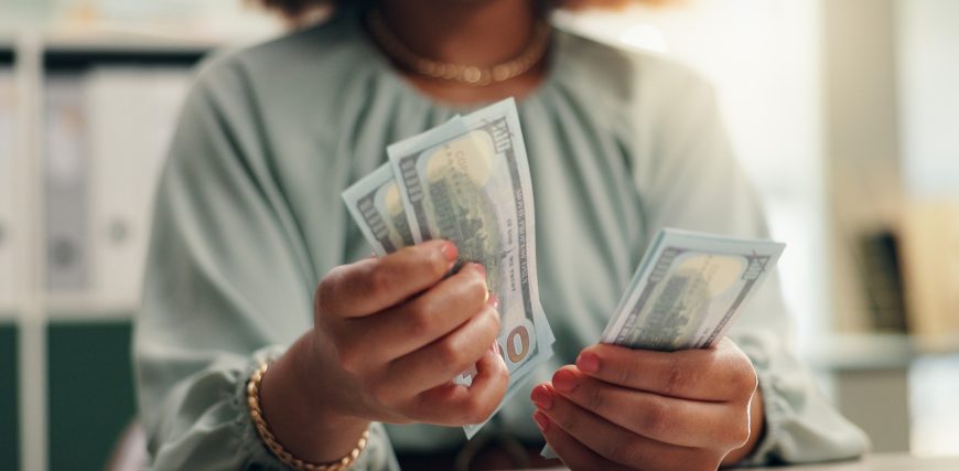 woman-counting-cash-100-dollar-bills_iStock-2190397359.jpg