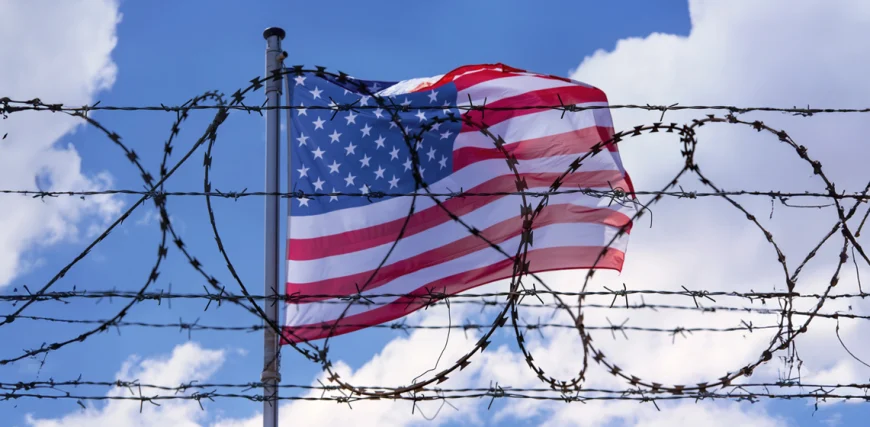 USA-Border-with-American-Flag-and-barbed-Wire.webp.webp