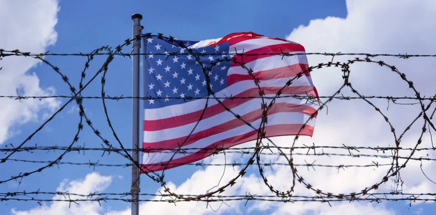 USA-Border-with-American-Flag-and-barbed-Wire.webp.webp